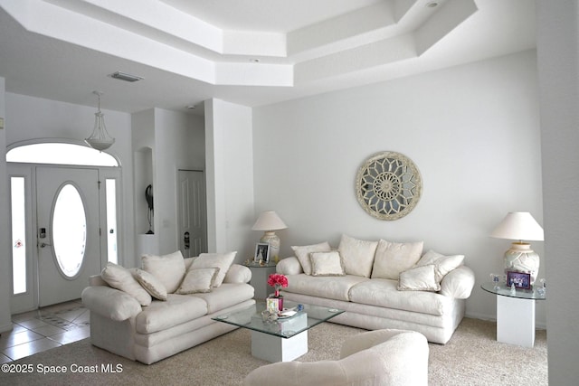 321 Brightwater Dr SE, Palm Bay, FL 32909 - living area featuring a tray ceiling and light tile patterned floors