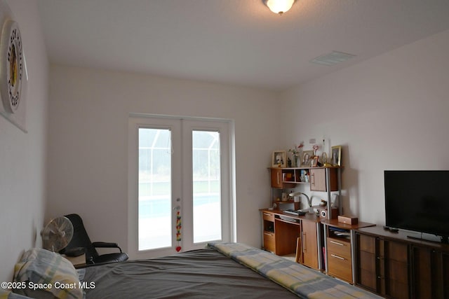 321 Brightwater Dr SE, Palm Bay, FL 32909 - bedroom with french doors and access to outside