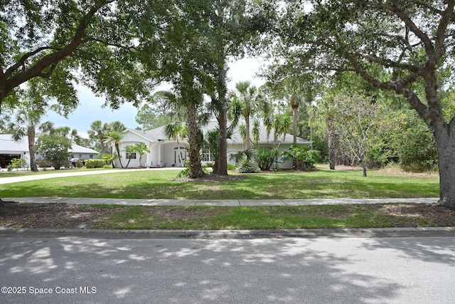321 Brightwater Dr SE, Palm Bay, FL 32909 - view of front of home with driveway and a front lawn