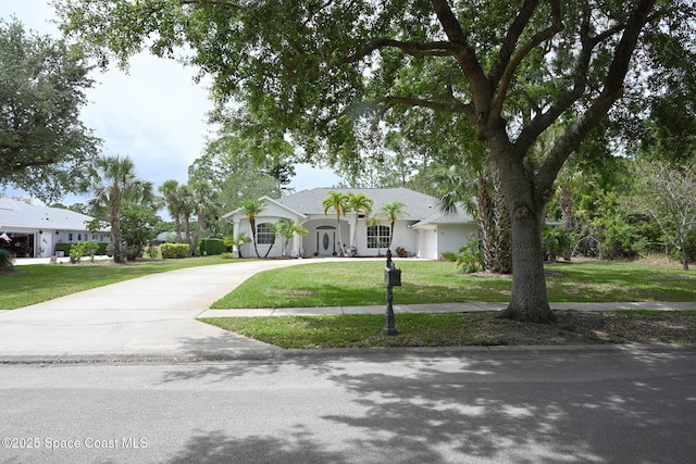 321 Brightwater Dr SE, Palm Bay, FL 32909 - view of front facade with driveway and a front yard