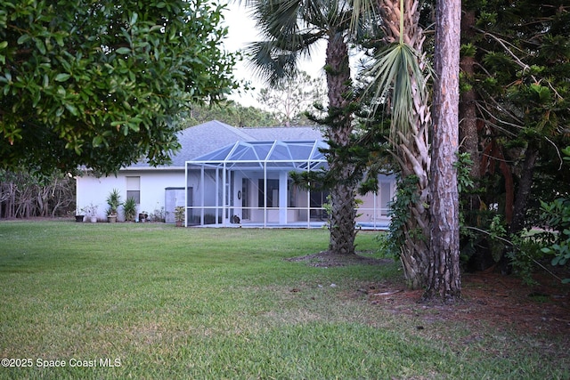 321 Brightwater Dr SE, Palm Bay, FL 32909 - view of front of home featuring a front yard, stucco siding, and a lanai