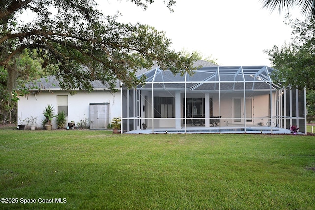 321 Brightwater Dr SE, Palm Bay, FL 32909 - rear view of property with a lawn, stucco siding, an outdoor pool, and glass enclosure