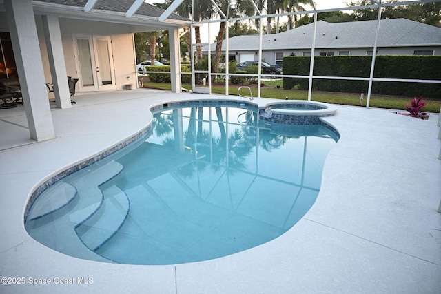 321 Brightwater Dr SE, Palm Bay, FL 32909 - view of swimming pool featuring a patio, a pool with connected hot tub, and glass enclosure
