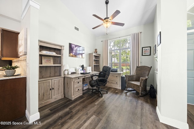 944 Osprey Ln, Rockledge, FL 32955 - office area with dark wood-type flooring, ceiling fan, baseboards, and high vaulted ceiling