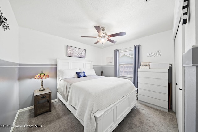 944 Osprey Ln, Rockledge, FL 32955 - carpeted bedroom featuring baseboards, a ceiling fan, and a textured ceiling