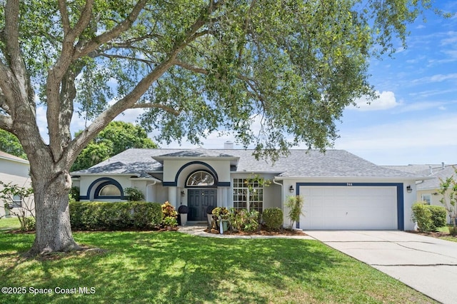 944 Osprey Ln, Rockledge, FL 32955 - ranch-style house featuring a garage, stucco siding, a front yard, concrete driveway, and a shingled roof
