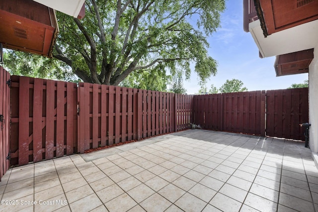 view of patio / terrace featuring fence
