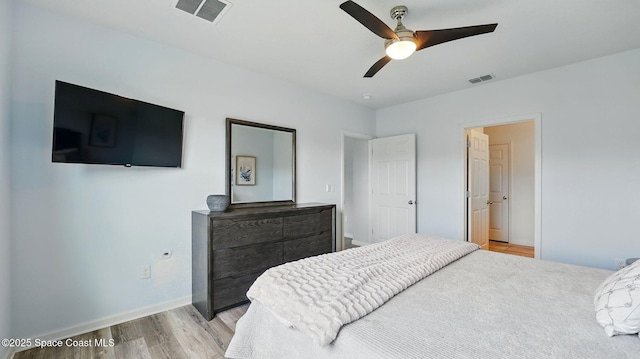bedroom with light wood-style flooring, baseboards, and a ceiling fan