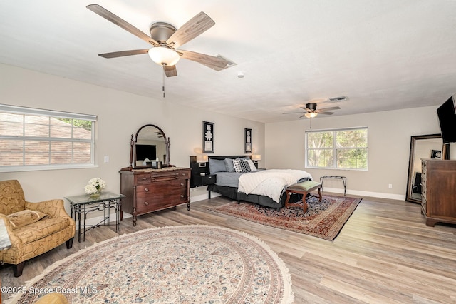 7703 Windover Way, Titusville, FL 32780 - bedroom with visible vents, baseboards, ceiling fan, and wood finished floors
