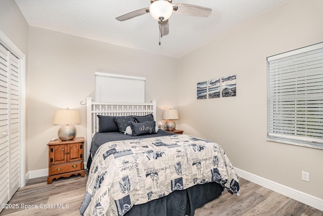 7703 Windover Way, Titusville, FL 32780 - bedroom with baseboards, ceiling fan, and wood finished floors