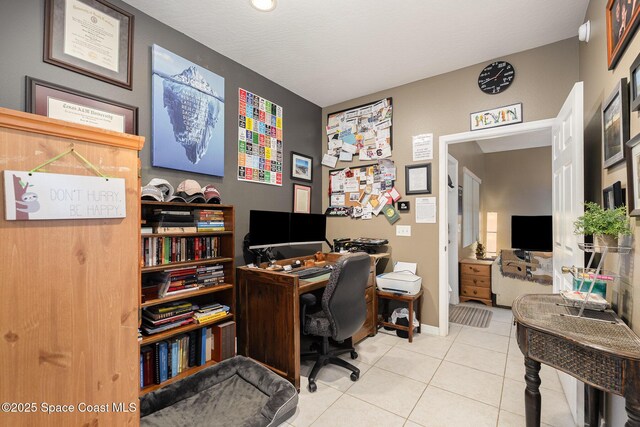 7703 Windover Way, Titusville, FL 32780 - tiled home office featuring baseboards