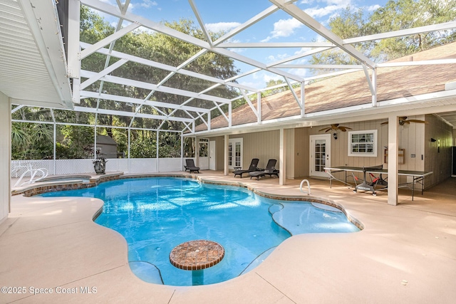 7703 Windover Way, Titusville, FL 32780 - view of swimming pool featuring a patio, french doors, a ceiling fan, a lanai, and a pool with connected hot tub