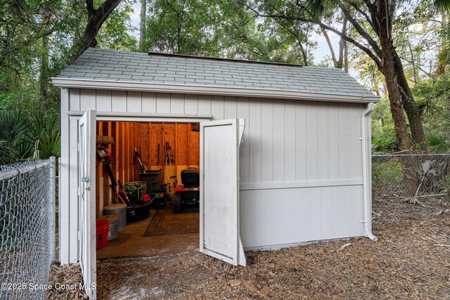 7703 Windover Way, Titusville, FL 32780 - view of outbuilding with an outdoor structure and fence