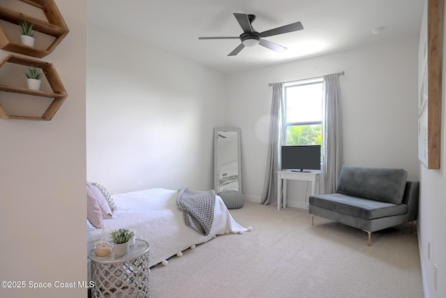 carpeted bedroom featuring ceiling fan and baseboards