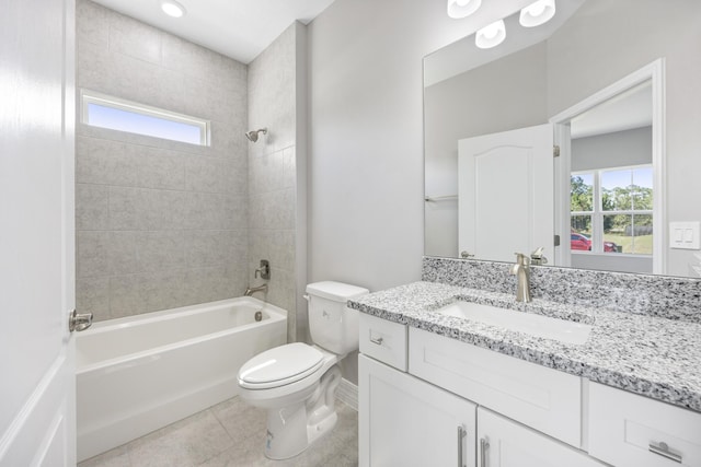 full bath with plenty of natural light, shower / bathing tub combination, tile patterned flooring, and toilet