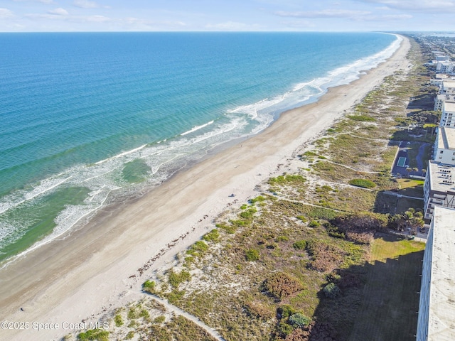 drone / aerial view with a view of the beach and a water view