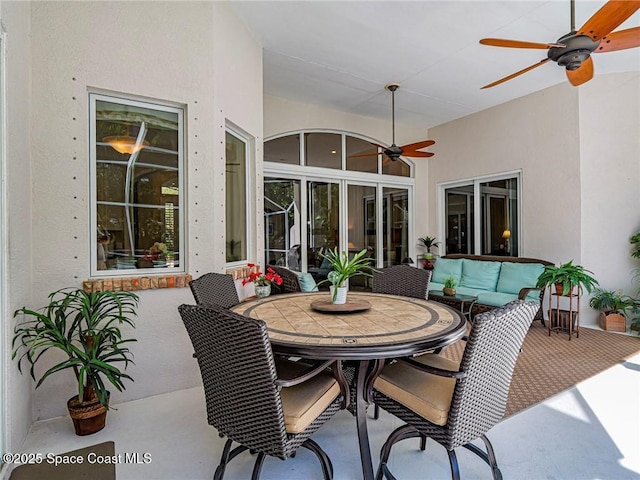 120 N White Jewel Ct, Vero Beach, FL 32963 - view of patio featuring an outdoor living space, a ceiling fan, and outdoor dining space