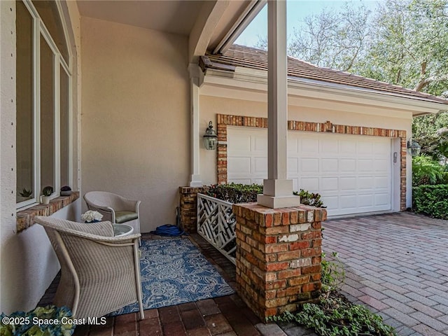 120 N White Jewel Ct, Vero Beach, FL 32963 - exterior space with decorative driveway and an attached garage