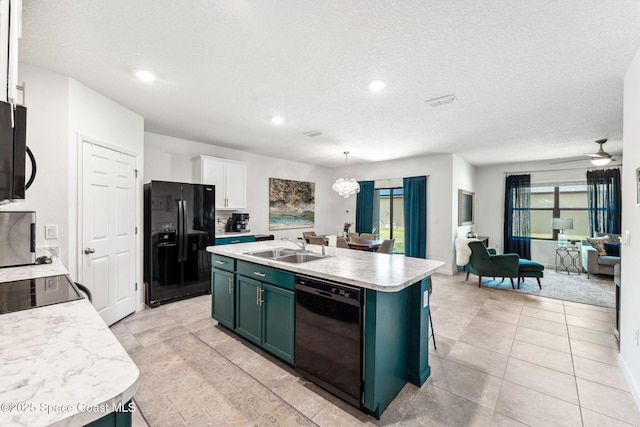 5985 Orsino Ln, Cocoa, FL 32926 - kitchen featuring black appliances, a sink, open floor plan, green cabinetry, and light countertops