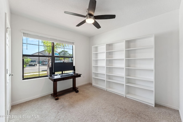 5985 Orsino Ln, Cocoa, FL 32926 - unfurnished office with carpet flooring, a ceiling fan, baseboards, and a textured ceiling