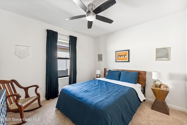 5985 Orsino Ln, Cocoa, FL 32926 - bedroom featuring light carpet, baseboards, a ceiling fan, and a textured ceiling