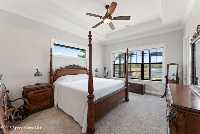 7773 Desmond Ave, Melbourne, FL 32940 - bedroom with light carpet, crown molding, a raised ceiling, baseboards, and ceiling fan