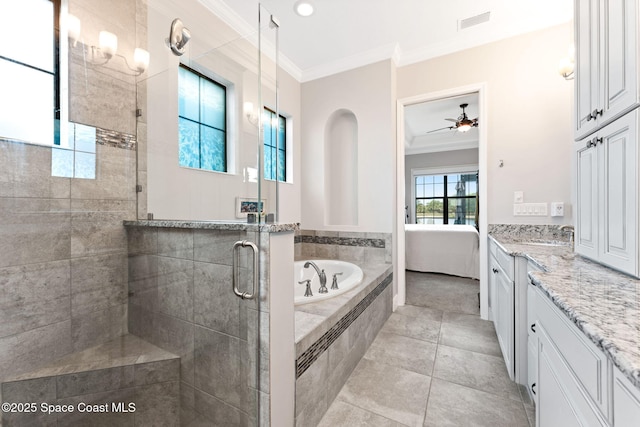7773 Desmond Ave, Melbourne, FL 32940 - bathroom with ornamental molding, a stall shower, vanity, ensuite bathroom, and a garden tub