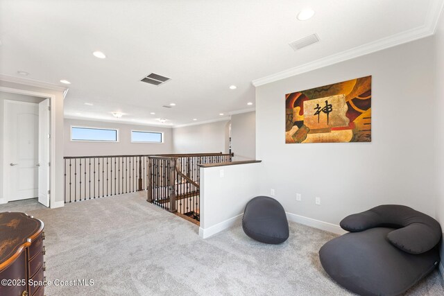 7773 Desmond Ave, Melbourne, FL 32940 - sitting room featuring crown molding, recessed lighting, carpet flooring, baseboards, and an upstairs landing