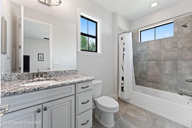 7773 Desmond Ave, Melbourne, FL 32940 - full bath with toilet, vanity, shower / bath combo, and tile patterned flooring
