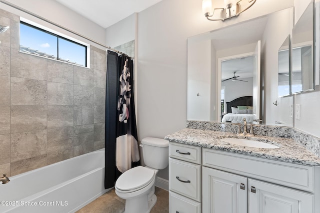 7773 Desmond Ave, Melbourne, FL 32940 - ensuite bathroom with toilet, vanity, shower / tub combo, ceiling fan, and baseboards