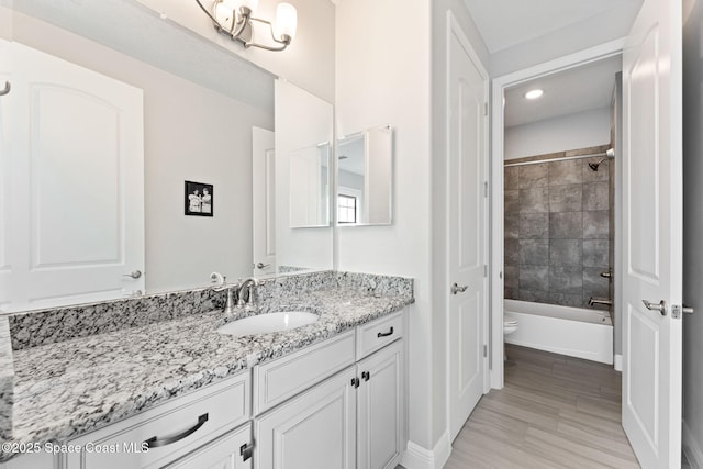 7773 Desmond Ave, Melbourne, FL 32940 - bathroom featuring vanity, baseboards, recessed lighting, toilet, and shower / bath combination