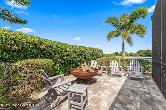 7773 Desmond Ave, Melbourne, FL 32940 - view of patio featuring an outdoor fire pit and agricultural area