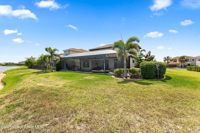7773 Desmond Ave, Melbourne, FL 32940 - view of grassy yard with glass enclosure and a water view