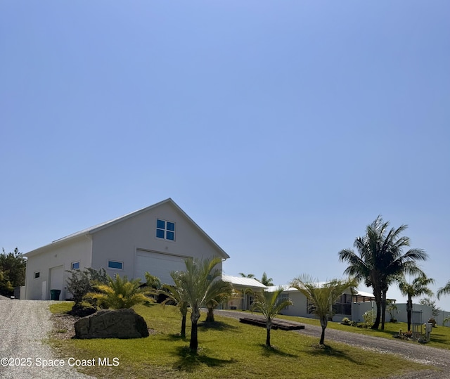 view of front of property with a front yard and stucco siding