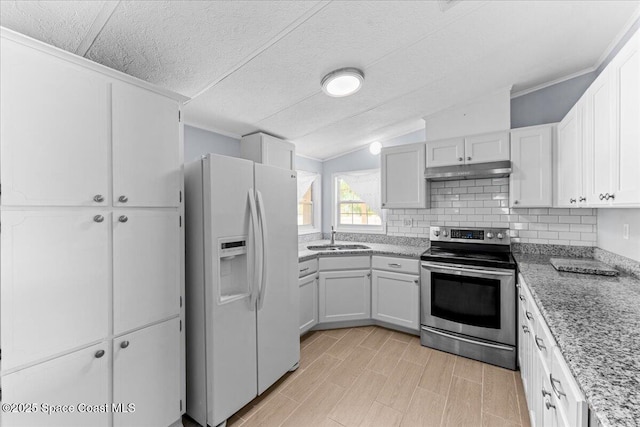 8865 Central Ave, Micco, FL 32976 - kitchen featuring white refrigerator with ice dispenser, electric range, a sink, under cabinet range hood, and white cabinetry