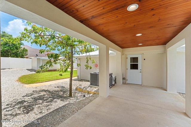 8865 Central Ave, Micco, FL 32976 - view of patio featuring fence and central air condition unit