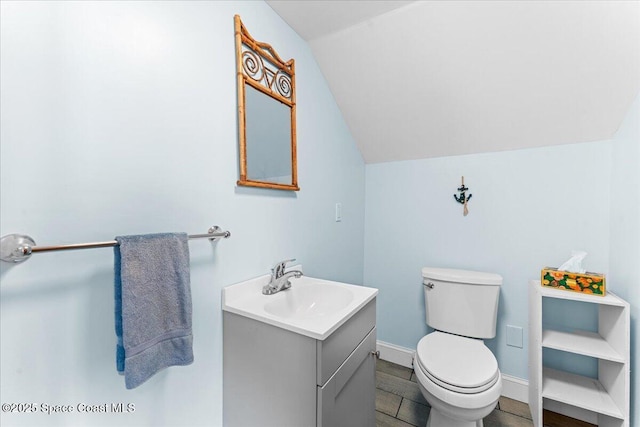 8865 Central Ave, Micco, FL 32976 - half bath with lofted ceiling, vanity, and toilet