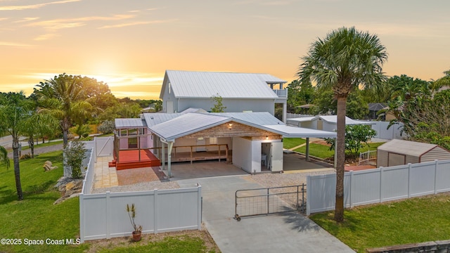 8865 Central Ave, Micco, FL 32976 - view of front of home featuring a gate and metal roof