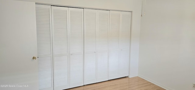 detailed view of baseboards and wood finished floors