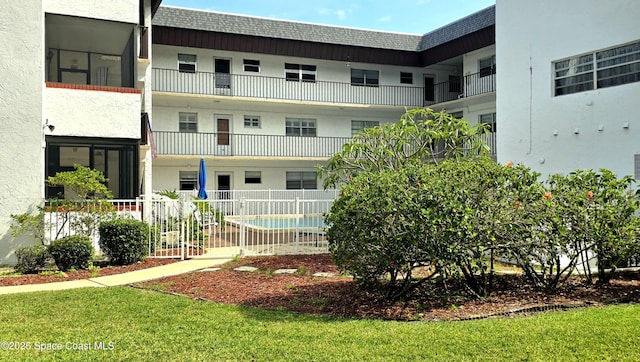 view of property featuring fence