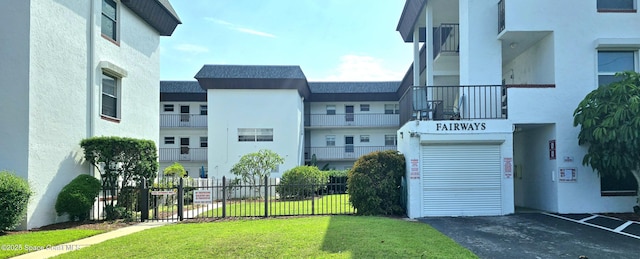 view of building exterior with fence