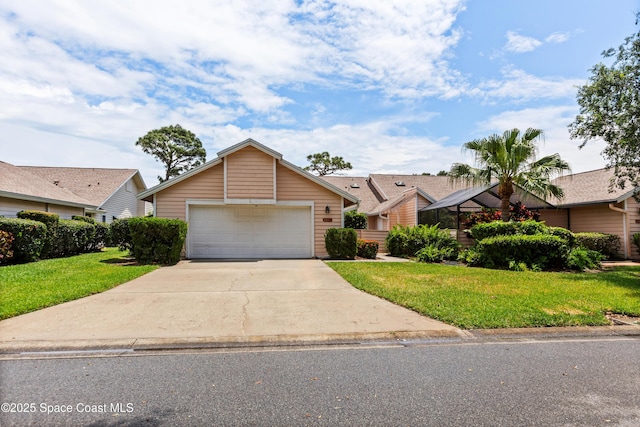 single story home featuring concrete driveway and a front lawn