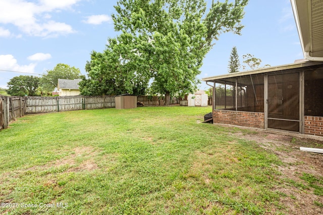 899 Emden Ave NW, Palm Bay, FL 32907 - view of yard with a shed, a sunroom, and an outbuilding