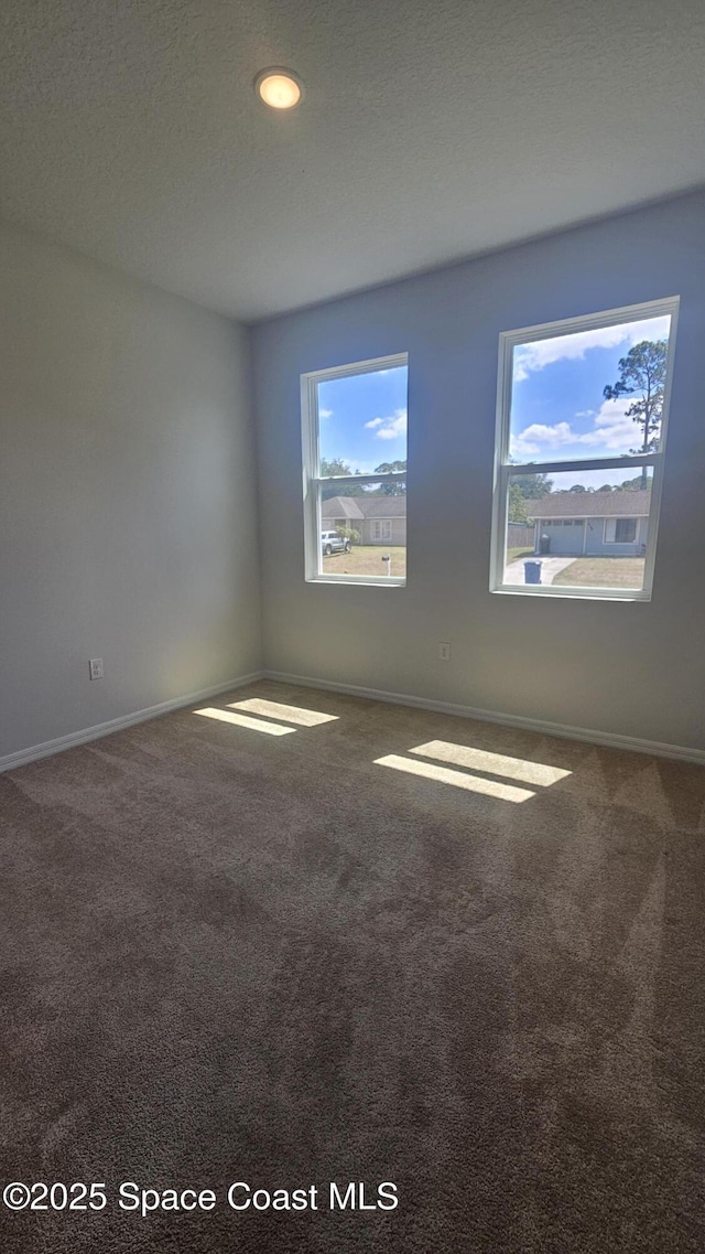 unfurnished room with carpet floors, baseboards, and recessed lighting
