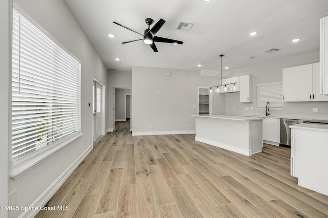 kitchen with light wood-style floors, dishwasher, a ceiling fan, recessed lighting, and visible vents