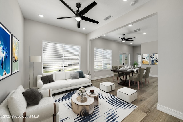 living area with a ceiling fan, baseboards, visible vents, and recessed lighting