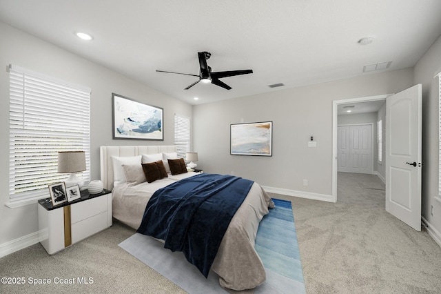 bedroom featuring ceiling fan, light carpet, recessed lighting, baseboards, and visible vents
