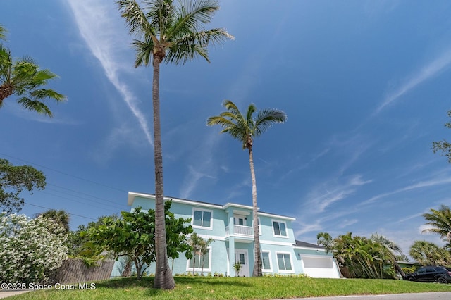 view of front of house featuring stucco siding and an attached garage
