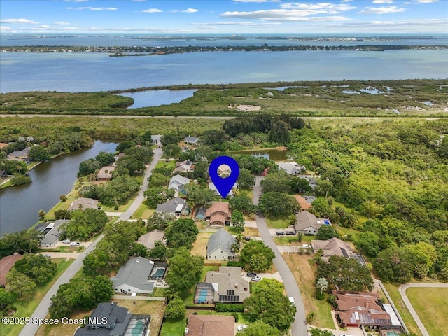 bird's eye view featuring a water view and a residential view