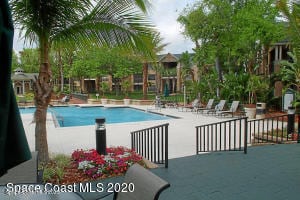 7667 N Wickham Rd Unit 903, Melbourne, FL 32940 - community pool with a patio area